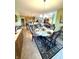Dining room features a table set for dinner with views into the kitchen and living room at 1688 Magnolia Dr, Greenwood, IN 46143