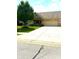 Inviting home showcasing a long driveway leading to a well-maintained front yard and charming porch at 1688 Magnolia Dr, Greenwood, IN 46143