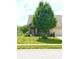 Charming home with a lush front lawn and cozy front porch creating an inviting and picturesque setting at 1688 Magnolia Dr, Greenwood, IN 46143