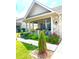 Charming home featuring a covered front porch with flower boxes and beautifully landscaped garden at 1688 Magnolia Dr, Greenwood, IN 46143