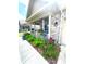 Charming front porch with decorative plants and flowers adding curb appeal to this attractive home at 1688 Magnolia Dr, Greenwood, IN 46143