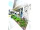 Charming home featuring a covered front porch with flower boxes and beautifully landscaped garden at 1688 Magnolia Dr, Greenwood, IN 46143