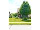 Charming brick home features a manicured lawn, lovely landscaping, and a welcoming front porch at 1688 Magnolia Dr, Greenwood, IN 46143