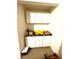 Organized garage space with white cabinets, a workbench, and ample storage for tools and equipment at 1688 Magnolia Dr, Greenwood, IN 46143