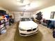 Clean, organized garage featuring a car and shelving for ample storage space at 1688 Magnolia Dr, Greenwood, IN 46143