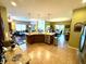 Open-concept kitchen featuring tile floors, granite counters, stainless appliances, and adjacent living and dining areas at 1688 Magnolia Dr, Greenwood, IN 46143