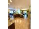 Open-concept kitchen featuring tile floors, granite counters, stainless appliances, and adjacent living and dining areas at 1688 Magnolia Dr, Greenwood, IN 46143