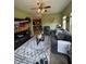 Inviting living room with cozy seating, television, fan and an open view into the kitchen at 1688 Magnolia Dr, Greenwood, IN 46143
