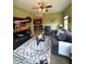 Inviting living room with cozy seating, television, fan and an open view into the kitchen at 1688 Magnolia Dr, Greenwood, IN 46143