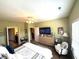 Spacious main bedroom featuring neutral carpet, ceiling fan, and stylish furnishings at 1688 Magnolia Dr, Greenwood, IN 46143