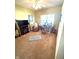 Home office with large window for natural light, desk, and hardwood floors at 1688 Magnolia Dr, Greenwood, IN 46143