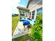 Outdoor patio with grill, wicker seating, and views of the well-maintained backyard, perfect for outdoor entertaining at 1688 Magnolia Dr, Greenwood, IN 46143