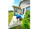 Outdoor patio with grill, wicker seating, and views of the well-maintained backyard, perfect for outdoor entertaining at 1688 Magnolia Dr, Greenwood, IN 46143