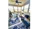 Bright sunroom with multiple windows, a ceiling fan, and beautiful outdoor views at 1688 Magnolia Dr, Greenwood, IN 46143