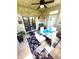 Bright sunroom featuring brick walls, a glass table, and comfortable seating, creating a relaxing atmosphere at 1688 Magnolia Dr, Greenwood, IN 46143