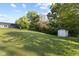 Expansive backyard featuring a large, well-maintained lawn and a storage shed at 1841 Shady Ln, Martinsville, IN 46151