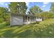 Backyard featuring a house with a screened-in porch and green grass at 1841 Shady Ln, Martinsville, IN 46151