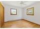 Bedroom featuring two windows, hardwood floors, and painted white walls at 1841 Shady Ln, Martinsville, IN 46151