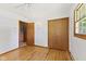 Bedroom featuring a ceiling fan, hardwood floors, and wood trim at 1841 Shady Ln, Martinsville, IN 46151
