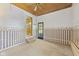 Bonus room with unique ceiling, charming wallpaper, and access to outdoor space at 1841 Shady Ln, Martinsville, IN 46151