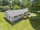 This angle shows the side of the home, as well as a deck and an attached garage at 1841 Shady Ln, Martinsville, IN 46151