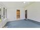 Sunroom featuring blue carpet, white walls, and natural light entering through a window at 1841 Shady Ln, Martinsville, IN 46151