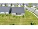 Aerial view of a home with a spacious backyard in a friendly residential neighborhood at 19195 River Jordan Dr, Westfield, IN 46074