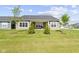 Lush backyard with green lawn and mature trees is perfect for entertaining at 19195 River Jordan Dr, Westfield, IN 46074