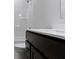Bathroom featuring dark wood vanity with a white countertop, modern faucet, and a shower/tub combo at 19195 River Jordan Dr, Westfield, IN 46074