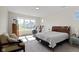 Spacious bedroom with a large window, hardwood floors and neutral wall color at 19195 River Jordan Dr, Westfield, IN 46074