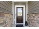 Covered front porch with stone accents and decorative bear statue at 19195 River Jordan Dr, Westfield, IN 46074