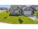 Front lawn of a house with a manicured lawn and stone accents at 19195 River Jordan Dr, Westfield, IN 46074