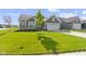 Well-maintained front yard with green grass and a stone facade at 19195 River Jordan Dr, Westfield, IN 46074