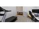 Bright home gym featuring carpet flooring, a treadmill, and a nearby workstation perfect for working out at 19195 River Jordan Dr, Westfield, IN 46074
