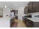 Large kitchen with hardwood flooring, kitchen island, stainless steel appliances, and a cozy rug at 19195 River Jordan Dr, Westfield, IN 46074