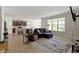 Inviting living room with natural light, hardwood flooring and open view to the kitchen area at 19195 River Jordan Dr, Westfield, IN 46074