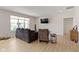 Comfortable living room with hardwood flooring and a large window offering scenic views at 19195 River Jordan Dr, Westfield, IN 46074