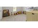 A spare room with carpet flooring, a large window, and a variety of decor and furniture at 19195 River Jordan Dr, Westfield, IN 46074