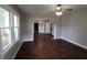 Spacious living room featuring hardwood floors, neutral walls, and arched doorways that add architectural interest at 2025 Fairview St, Anderson, IN 46016