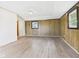 Unfinished basement featuring wood paneled walls and neutral flooring at 203 Plum E St, Frankton, IN 46044