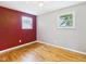 Bedroom with two windows and hardwood floors at 203 Plum E St, Frankton, IN 46044