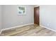 Bedroom with neutral gray walls and light wood flooring at 203 Plum E St, Frankton, IN 46044