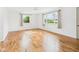 Spacious bedroom featuring hardwood floors and two large windows at 203 Plum E St, Frankton, IN 46044