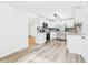 Bright kitchen features stainless steel appliances, white cabinetry, and modern backsplash at 203 Plum E St, Frankton, IN 46044