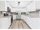 Well-lit kitchen features stainless steel appliances and new cabinetry at 203 Plum E St, Frankton, IN 46044