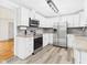 Well-lit kitchen featuring stainless steel appliances and new cabinetry at 203 Plum E St, Frankton, IN 46044