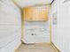 Functional laundry room with overhead cabinets at 203 Plum E St, Frankton, IN 46044