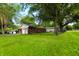 Expansive, well-maintained backyard featuring a chain-link fence for added privacy at 207 E Waterbury Rd, Indianapolis, IN 46227