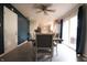 Bright dining area with access to the kitchen features modern table set, and plenty of natural light at 207 E Waterbury Rd, Indianapolis, IN 46227