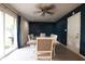 Cozy dining room features modern lighting, slider to the backyard, and easy access to the kitchen at 207 E Waterbury Rd, Indianapolis, IN 46227